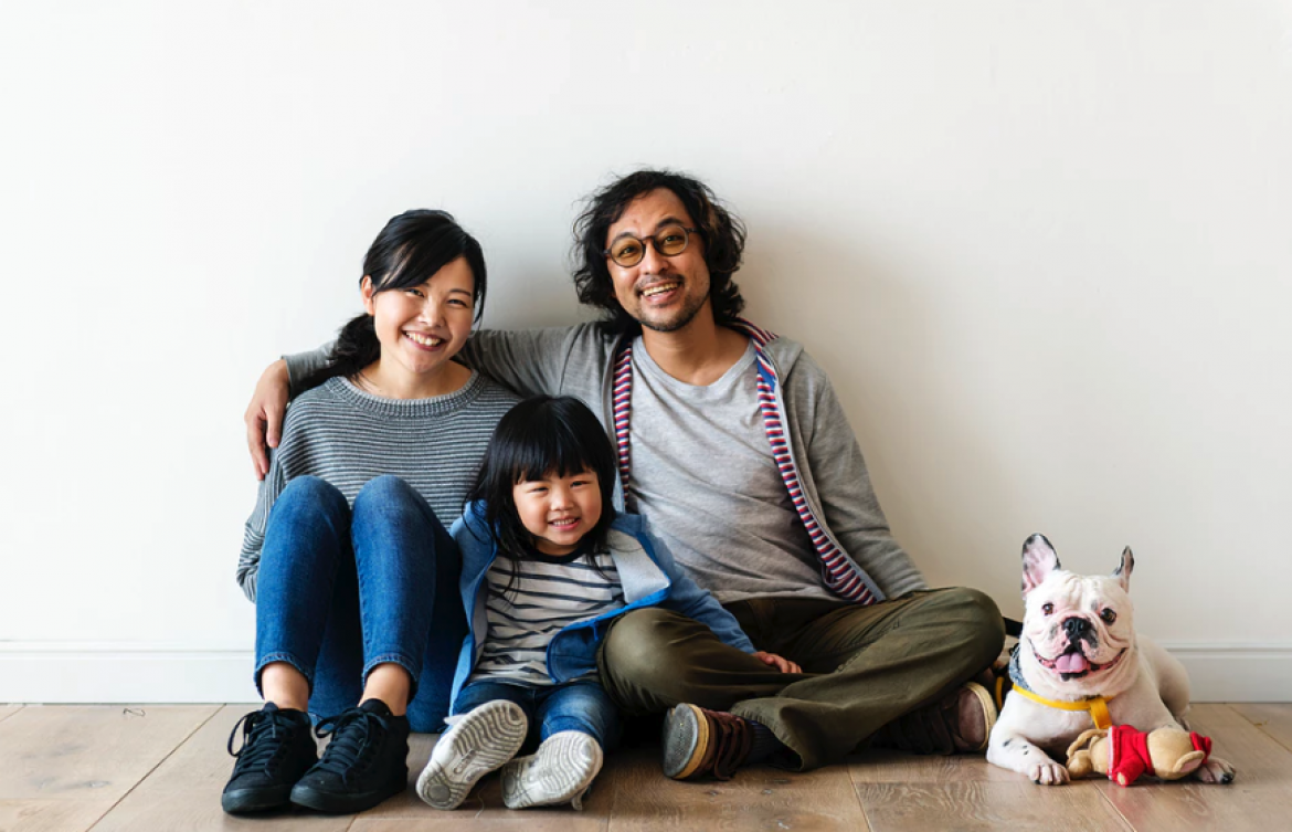 Happy Asian family in new home